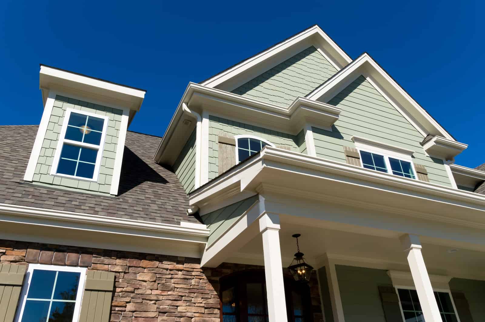 close up view of vinyl siding and gutters on home